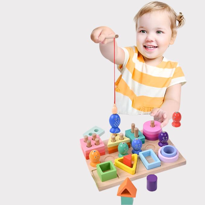 Child using a fishing rod to lift a blue fish from the wooden activity board
