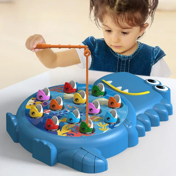 Child using an orange fishing rod to catch a fish on the blue dinosaur game board.