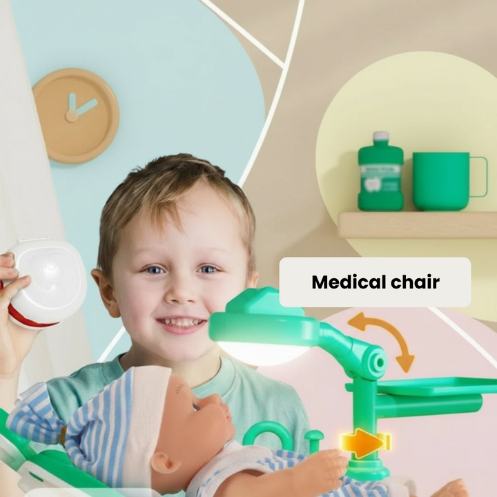 Child playing with a doll in the green toy medical chair