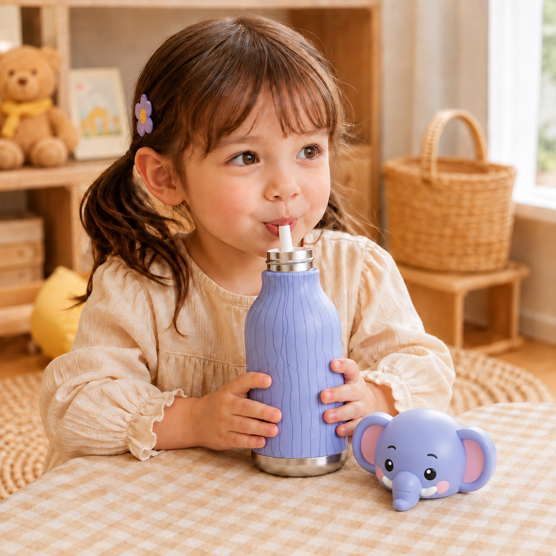 Child drinking from a purple elephant thermos bottle with the animal cap beside her