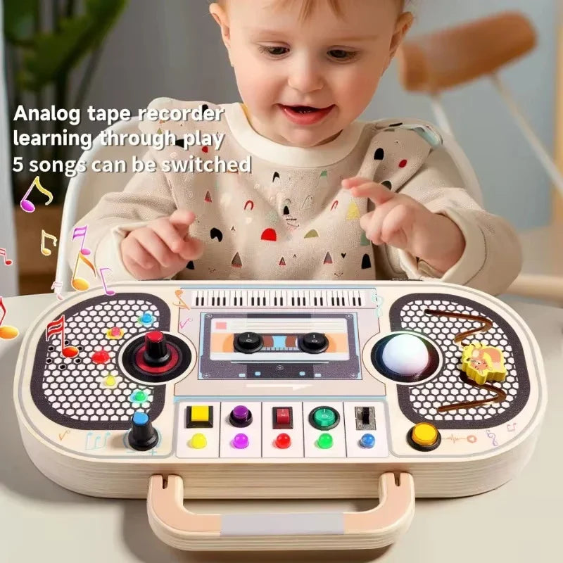Child exploring a boombox-style wooden activity board laid flat on a table