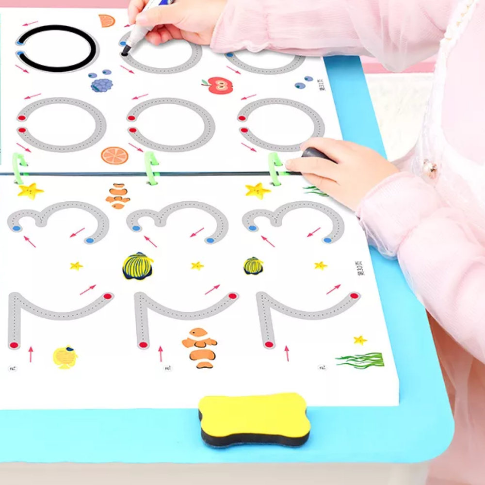 Child tracing large curved lines in a ring-bound workbook with a yellow eraser beside it.