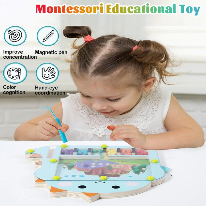 Child using a magnetic pen to move colorful beads on a dinosaur-shaped board