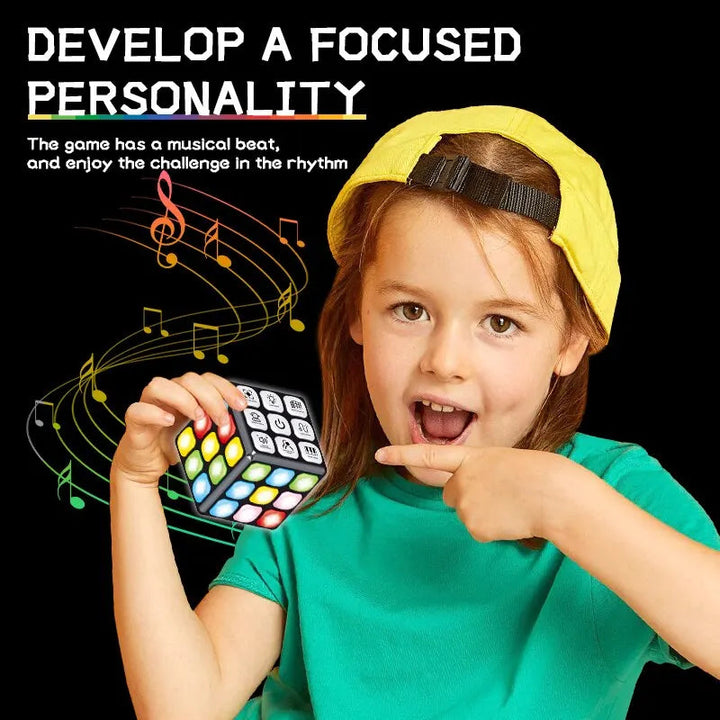 Child holding a light-up activity cube with colorful buttons