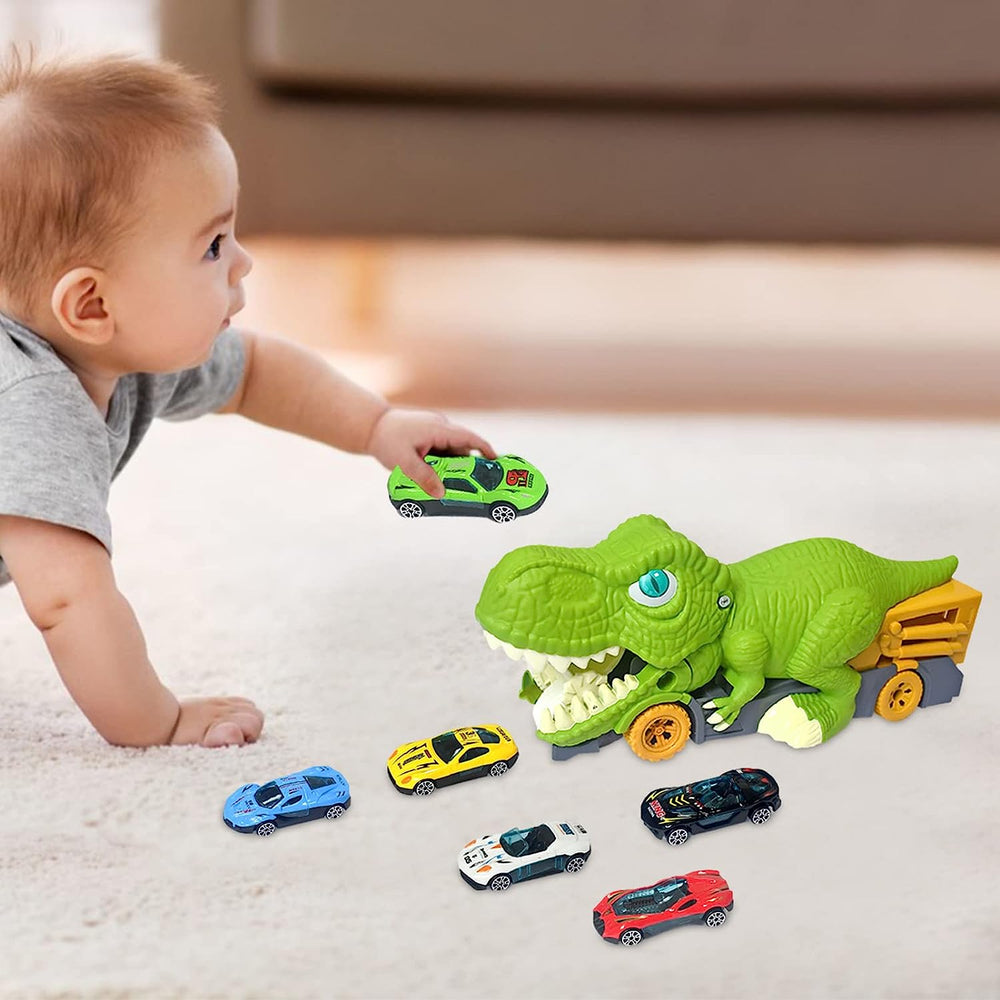 Child holding a green mini car beside the dinosaur truck and five other toy cars