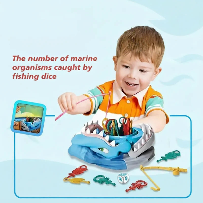 Child uses a fishing rod with the shark game, with sea creature pieces and dice on the table.