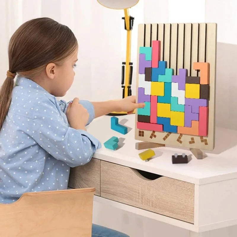 Child arranging colorful wooden blocks on a standing puzzle board at a desk