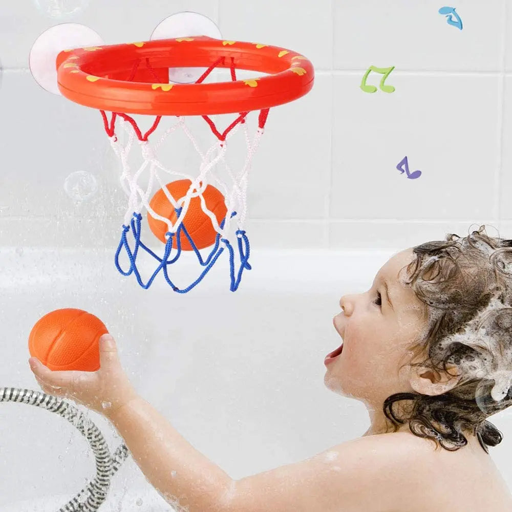 Child playing with an orange bath basketball hoop attached to a tiled wall
