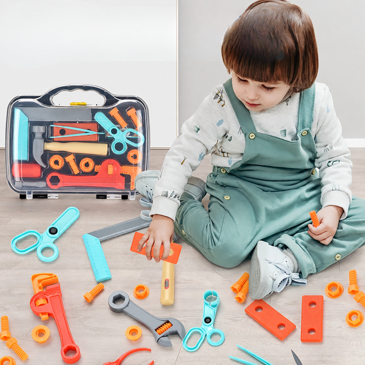 Child exploring colorful toy tools and play hardware beside a carrying case
