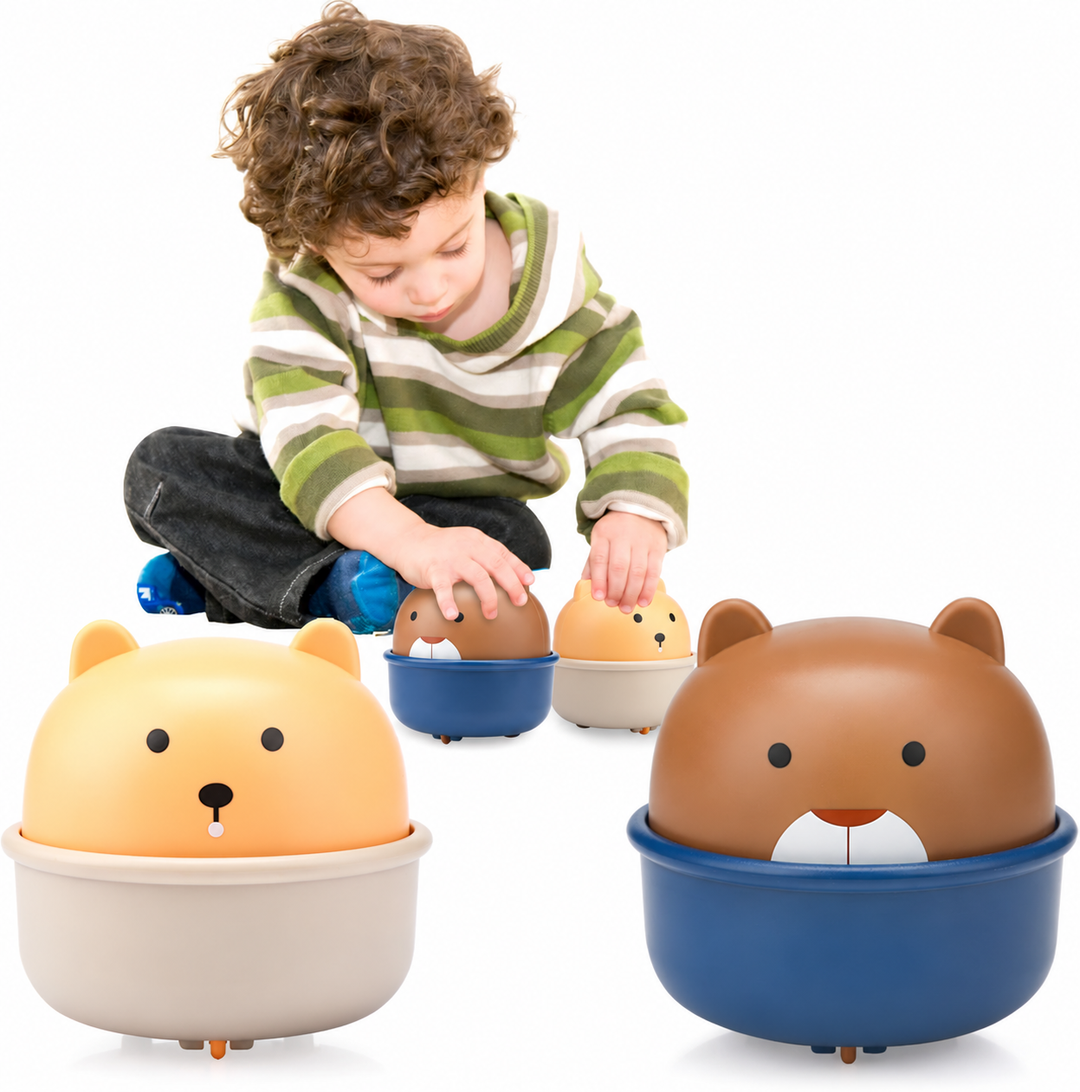 Child playing with brown and yellow wind-up animal toy cars