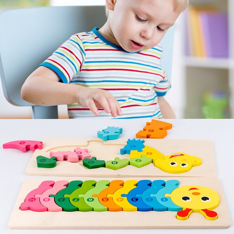 Child arranging colorful wooden animal puzzle pieces beside a completed caterpillar puzzle