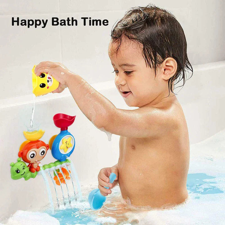 Child pouring water from a yellow cup into the wall-mounted animal bath toy