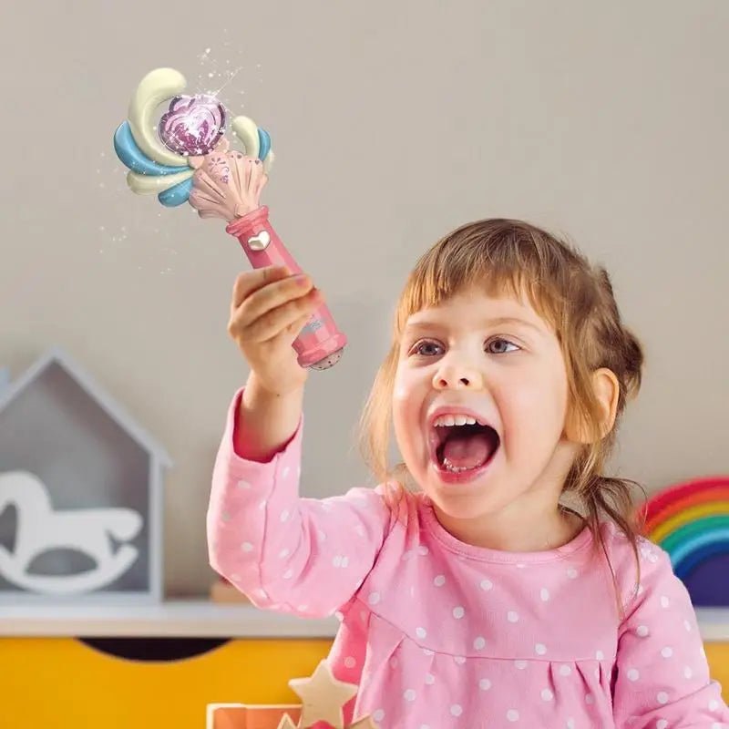 Child raising a pink toy wand with a glowing pink center
