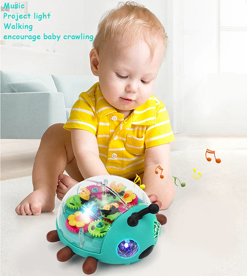 Child in a yellow striped shirt reaching toward the musical crawling beetle toy