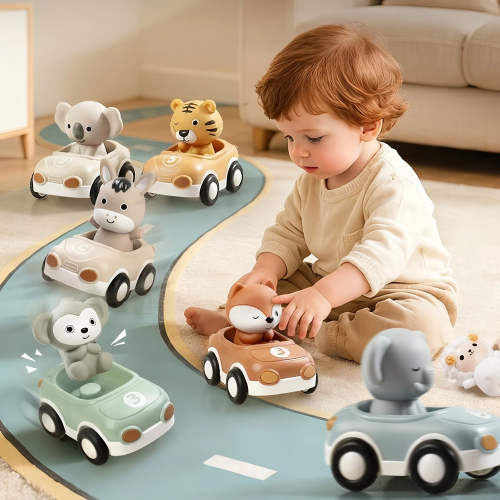 Child playing with a fox toy car on a road mat surrounded by other animal cars