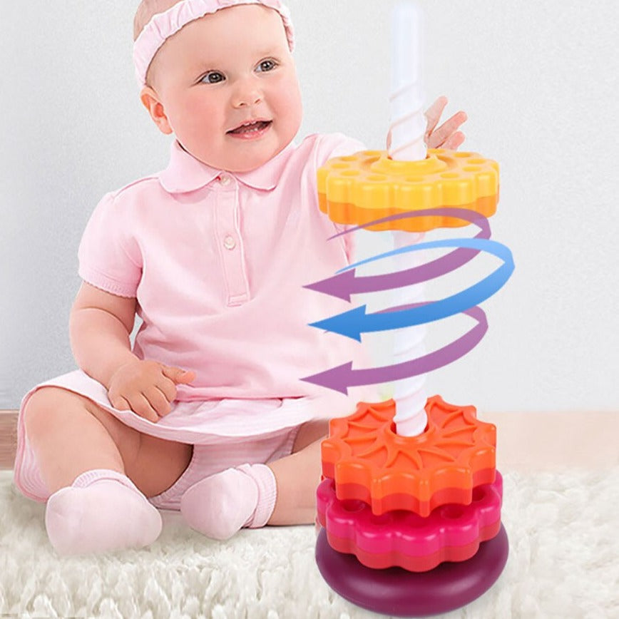 Child beside a stacking tower with arrows illustrating a yellow disc's spinning motion
