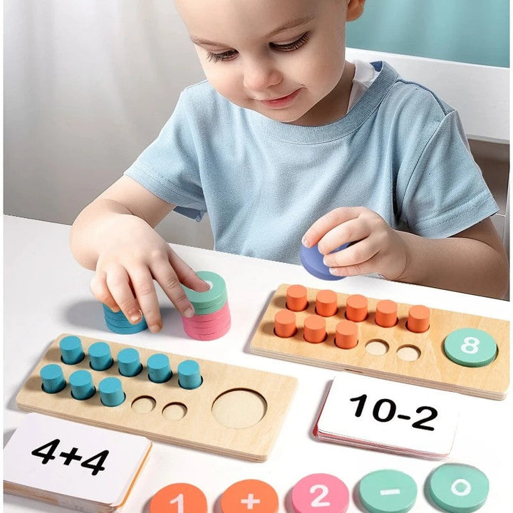 Child arranging colorful counting pieces on wooden ten-frame boards beside addition and subtraction cards