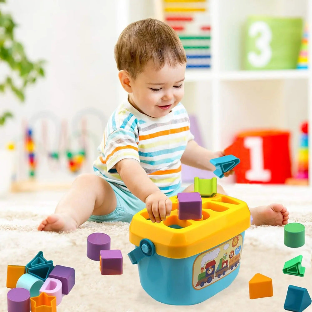 Child fitting colorful blocks into the yellow lid of a shape sorting bucket