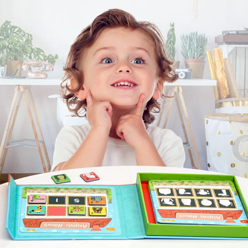 Child seated behind an open animal memory game