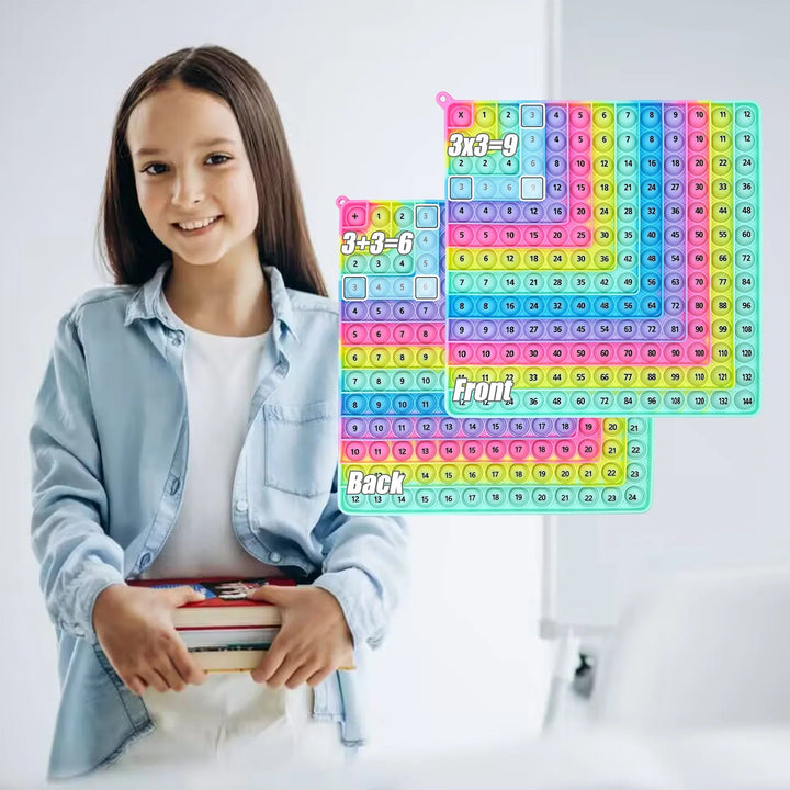 Child holding books beside front and back views of a light rainbow math fidget board