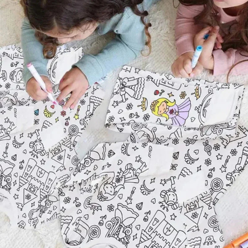 Two children coloring printed pajama designs with markers