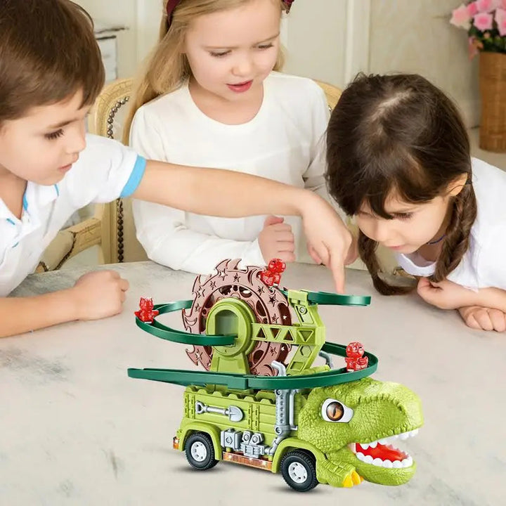 Three children gathered around a dinosaur truck with green tracks and red dinosaur figures