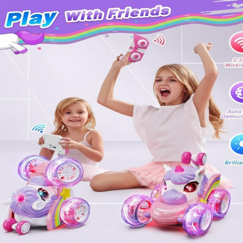 Two children holding remotes beside light-up unicorn RC stunt cars