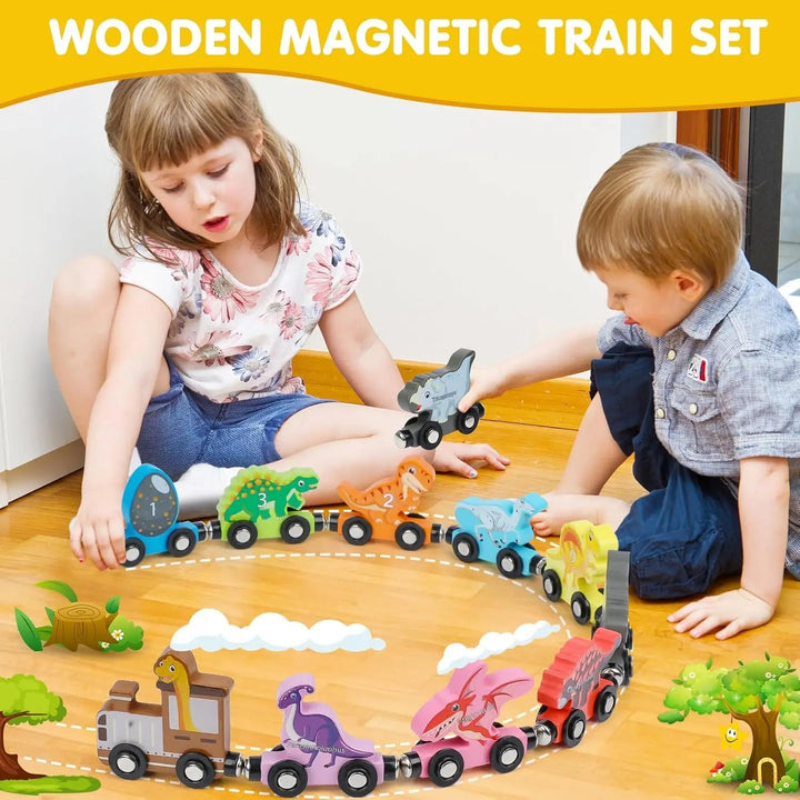 Two children playing with a wooden dinosaur train arranged in a curve