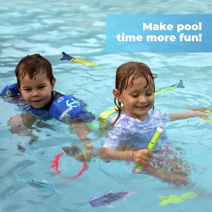 Two children playing in a pool with colorful diving toys