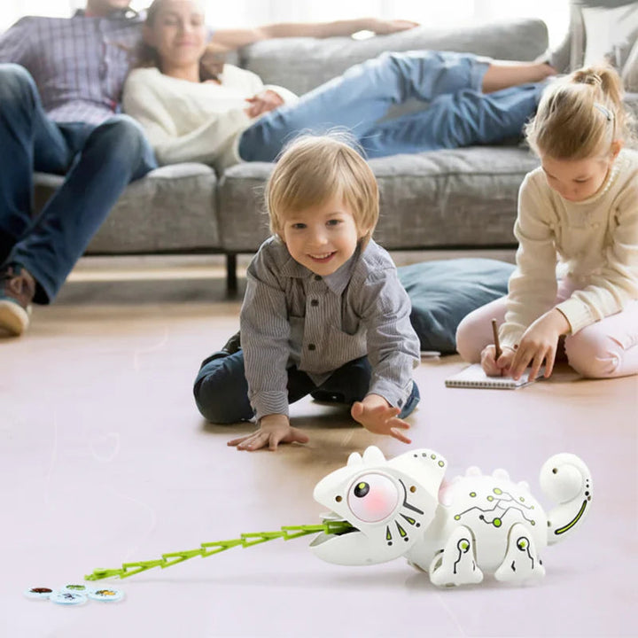 Children playing on the floor with a remote-controlled chameleon and insect-themed discs.