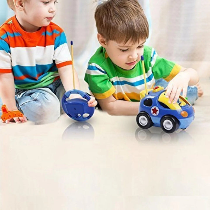Two children playing with a police toy car and its steering-wheel-shaped remote