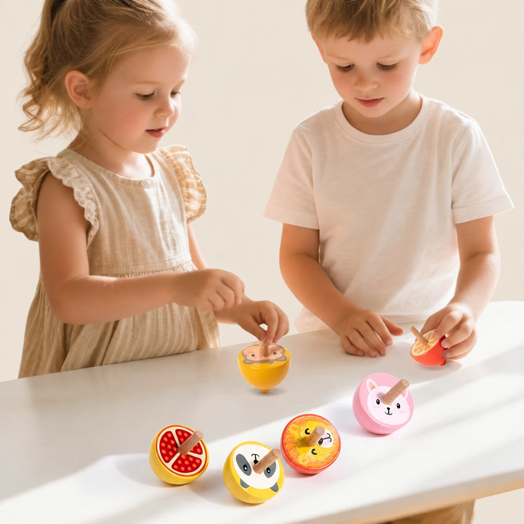 Two children playing with colorful wooden spinning tops on a white table