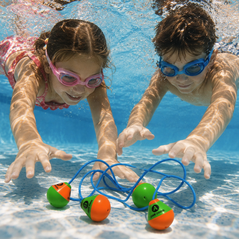 Two children wearing goggles reach for blue loop diving toys on the pool floor