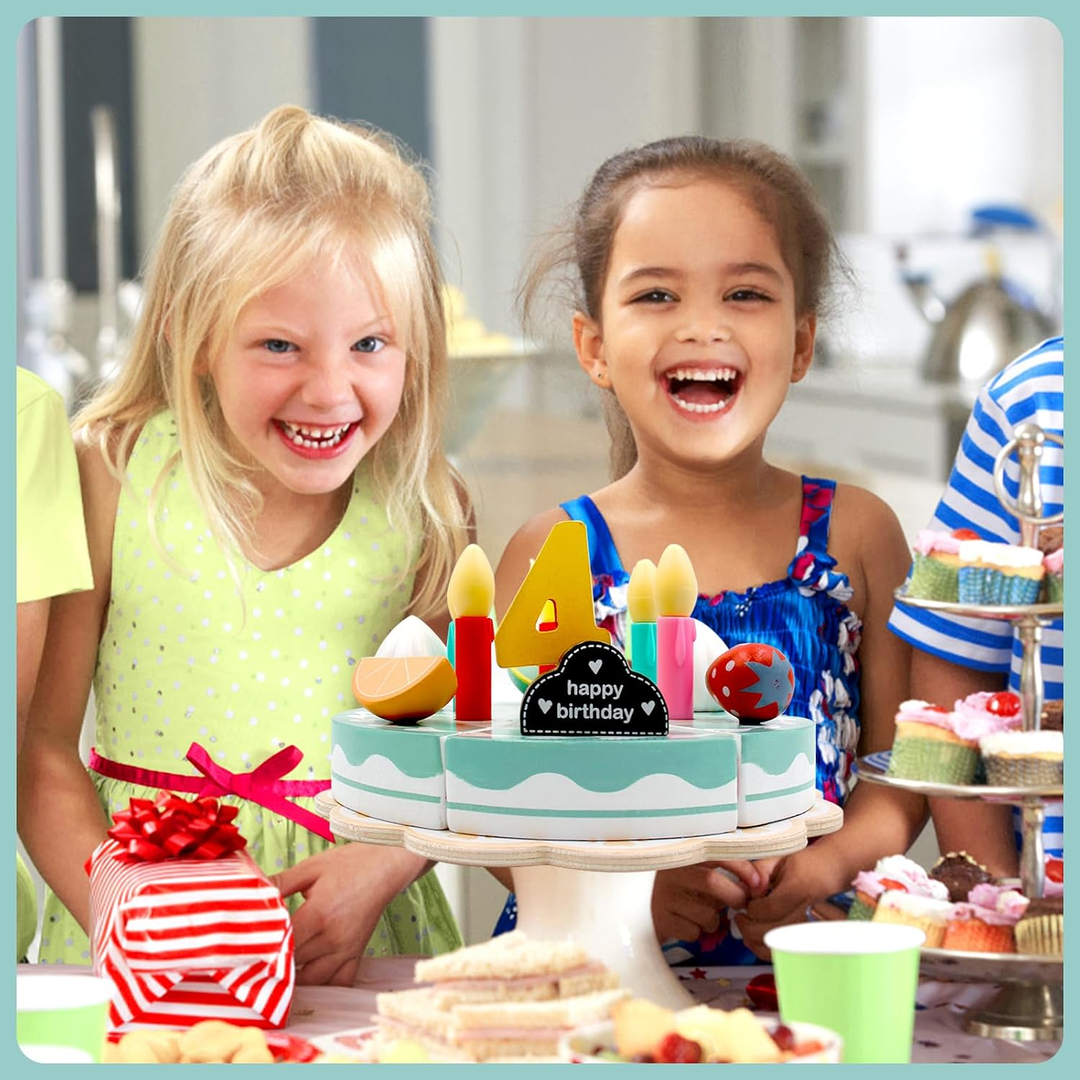 Two children smiling behind a wooden birthday cake decorated with candles and a number four