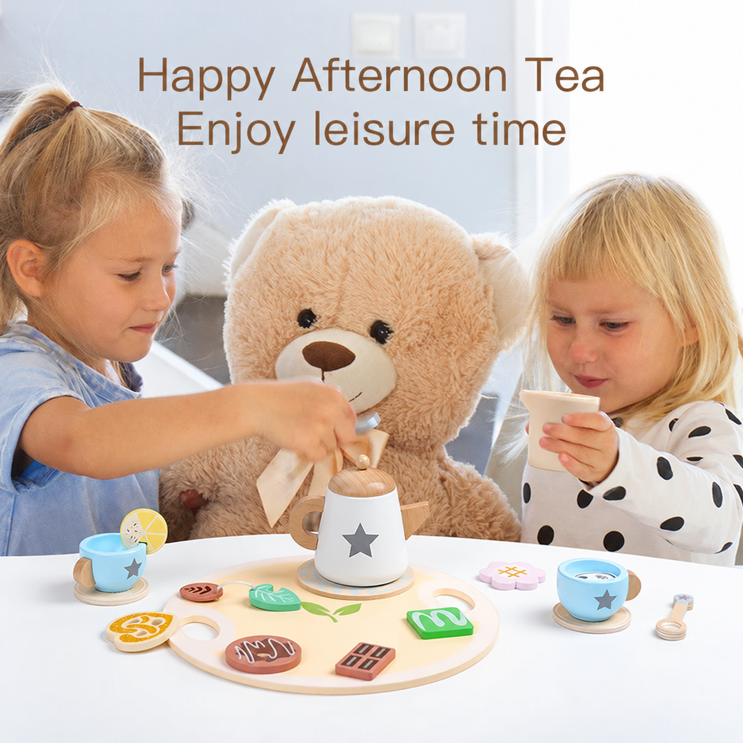 Two children share a pretend tea party with a blue star-pattern tea set and a teddy bear
