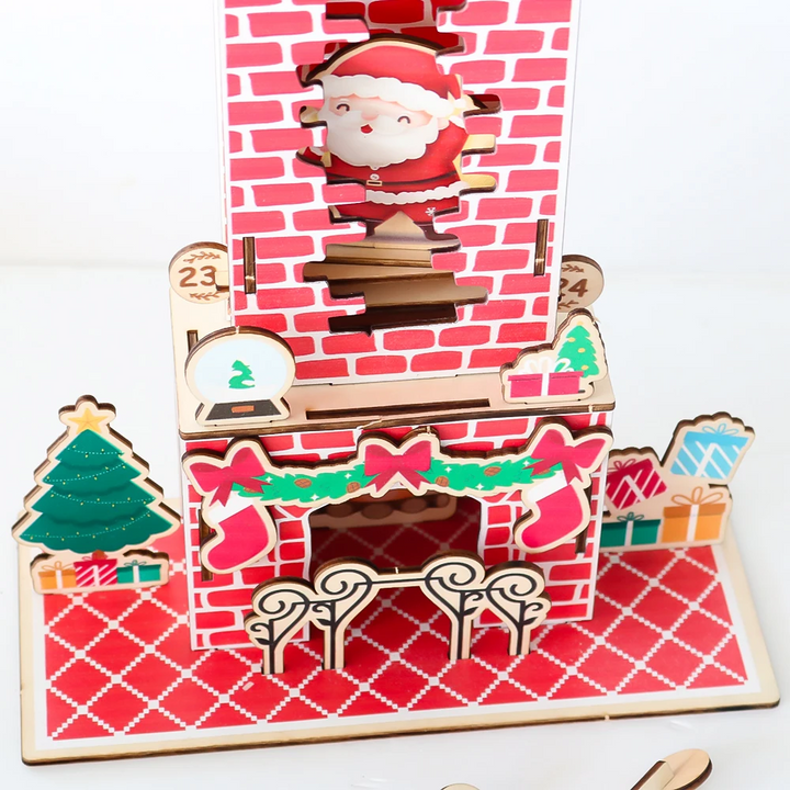 Christmas countdown calendar base with a fireplace, tree, presents, and Santa above