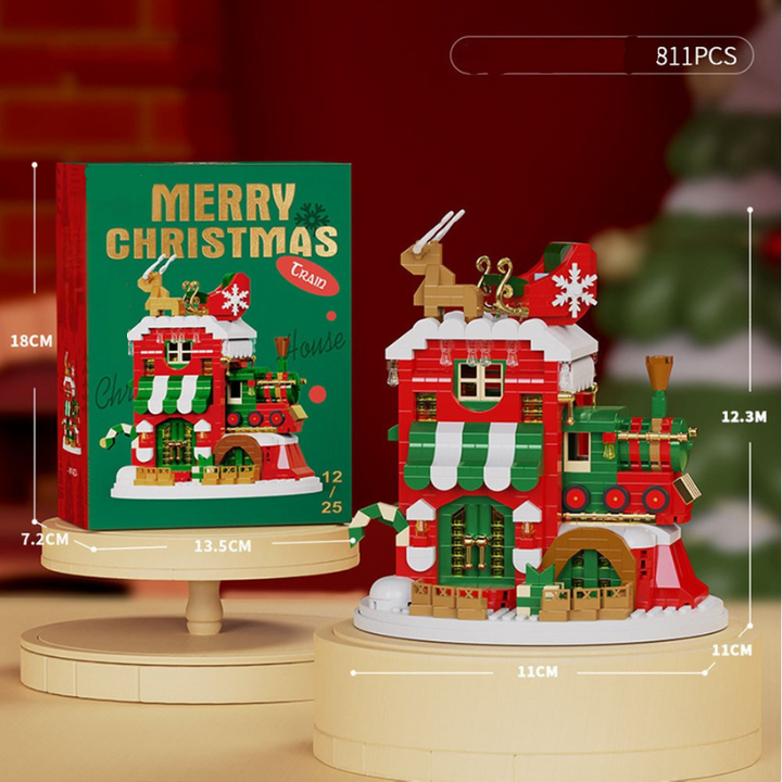 Christmas house building block model with a rooftop reindeer, train, and 811-piece count