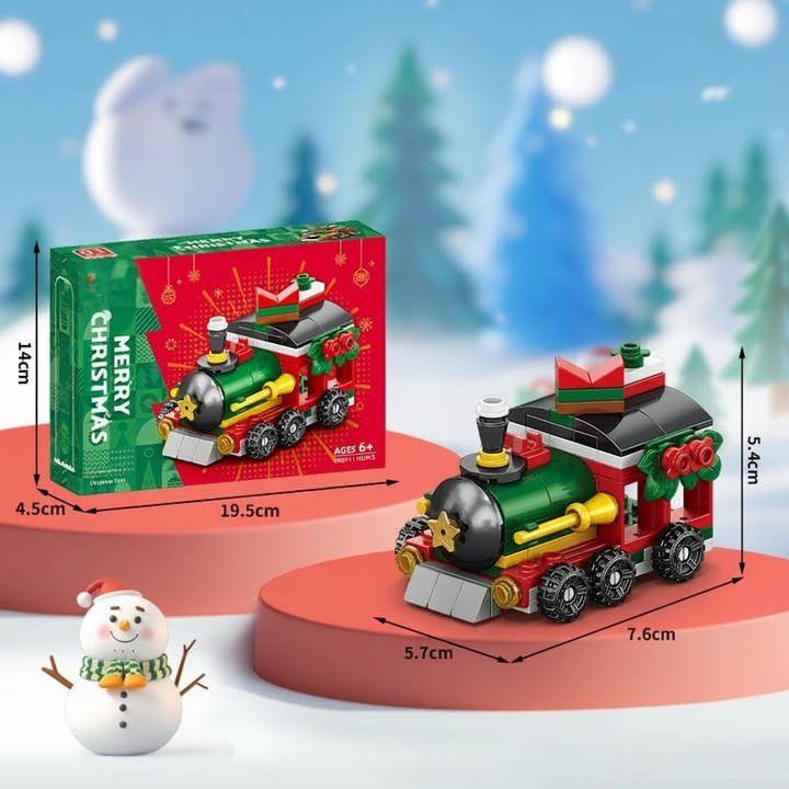 Christmas train building model with green, red, and gold details and labeled dimensions