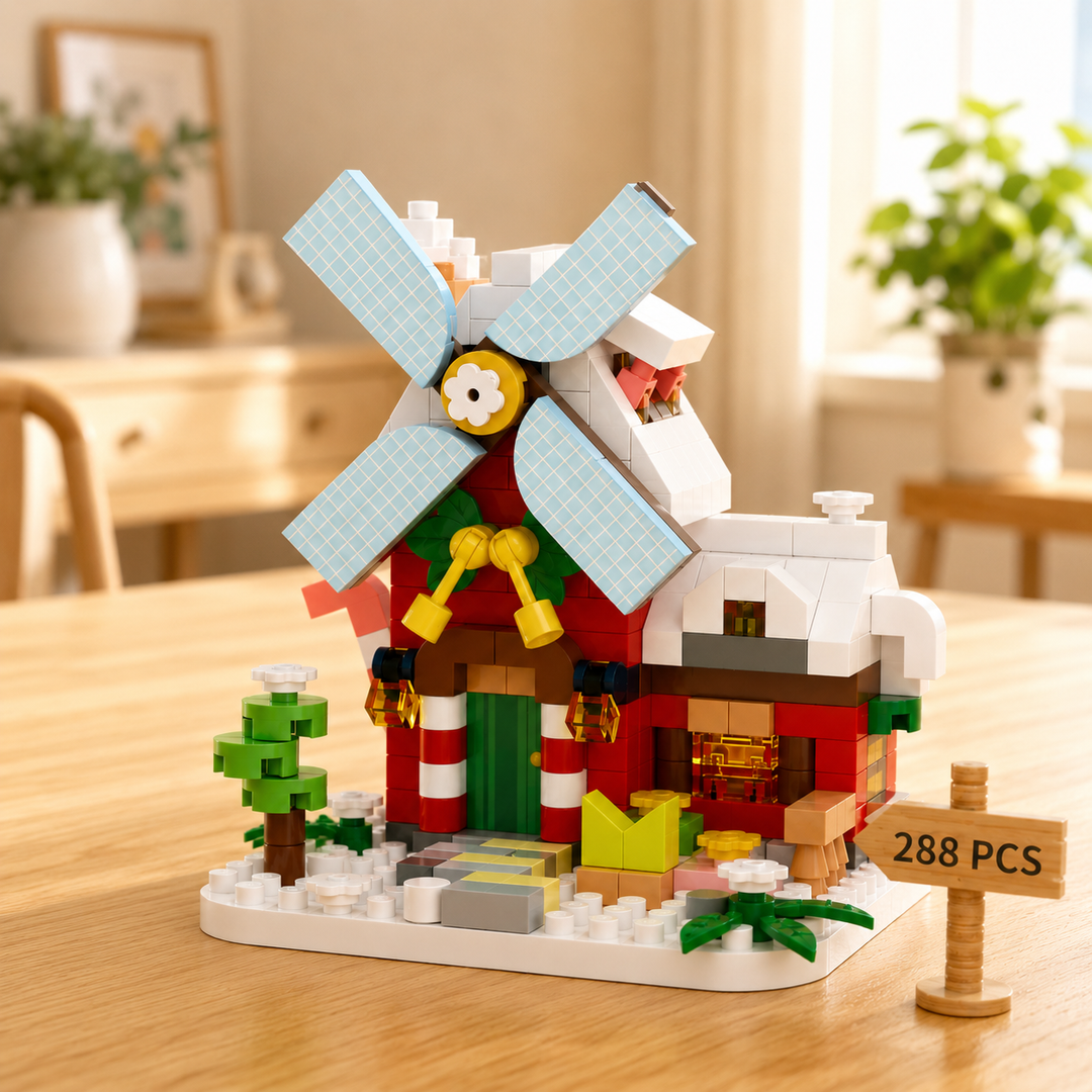 Red Christmas windmill block model with pale blue blades, snowy details and gift decorations.