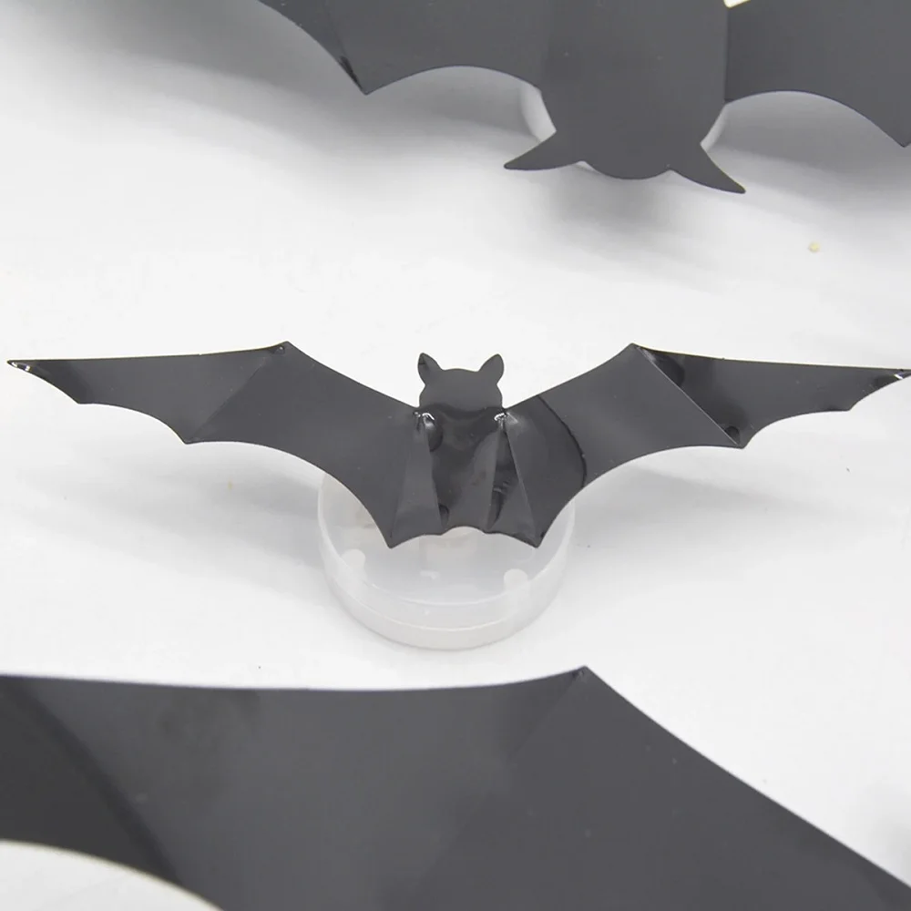 Close-up of a folded black bat and the circular light unit beneath it