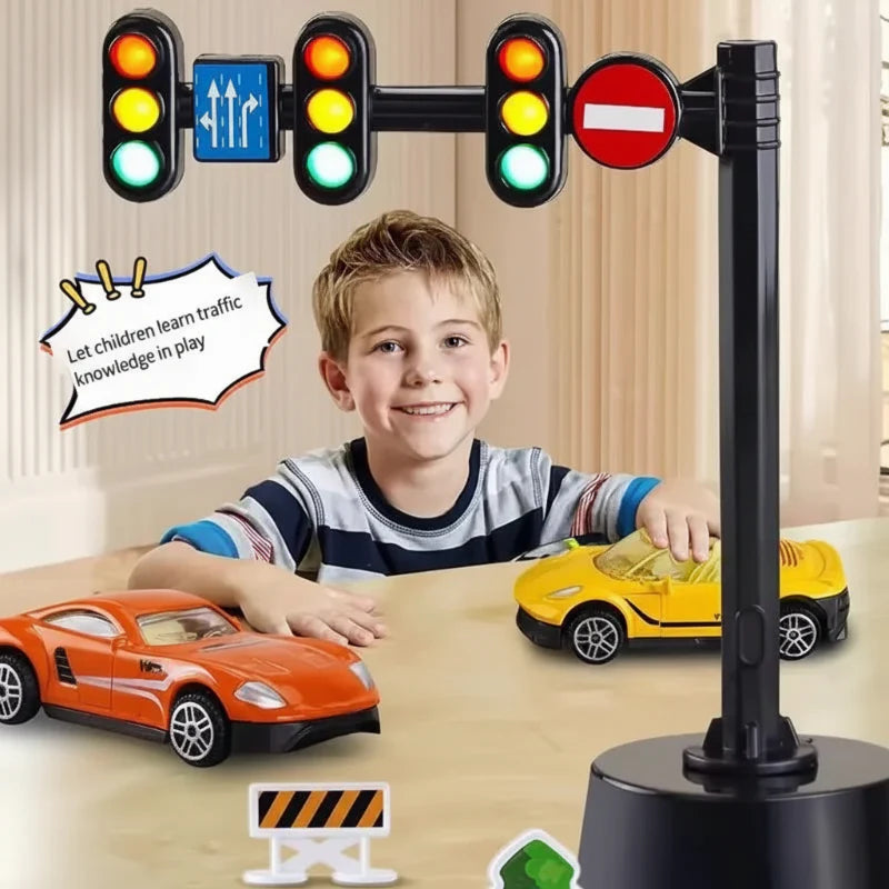 Child playing with toy cars beside a three-signal traffic light with road signs.