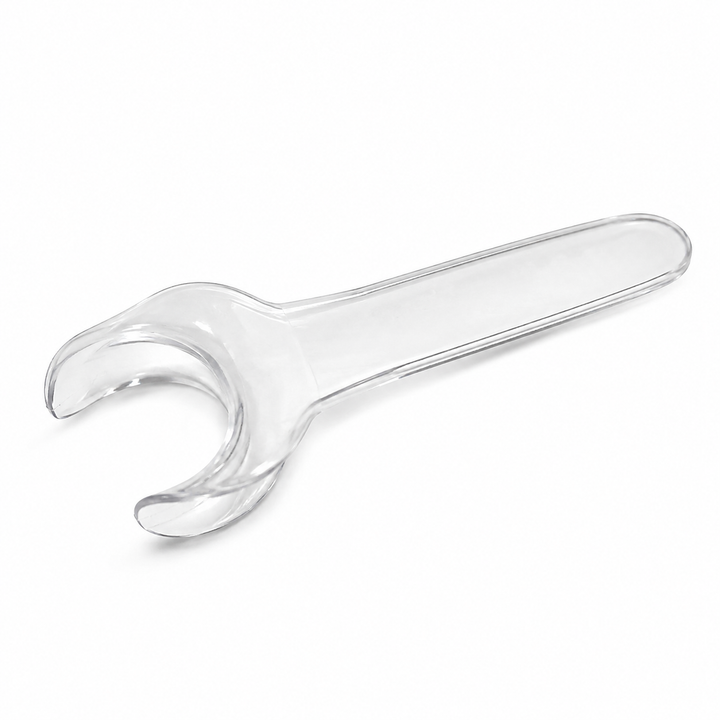Clear plastic dental care aid with a curved mouthpiece and long handle on a white background