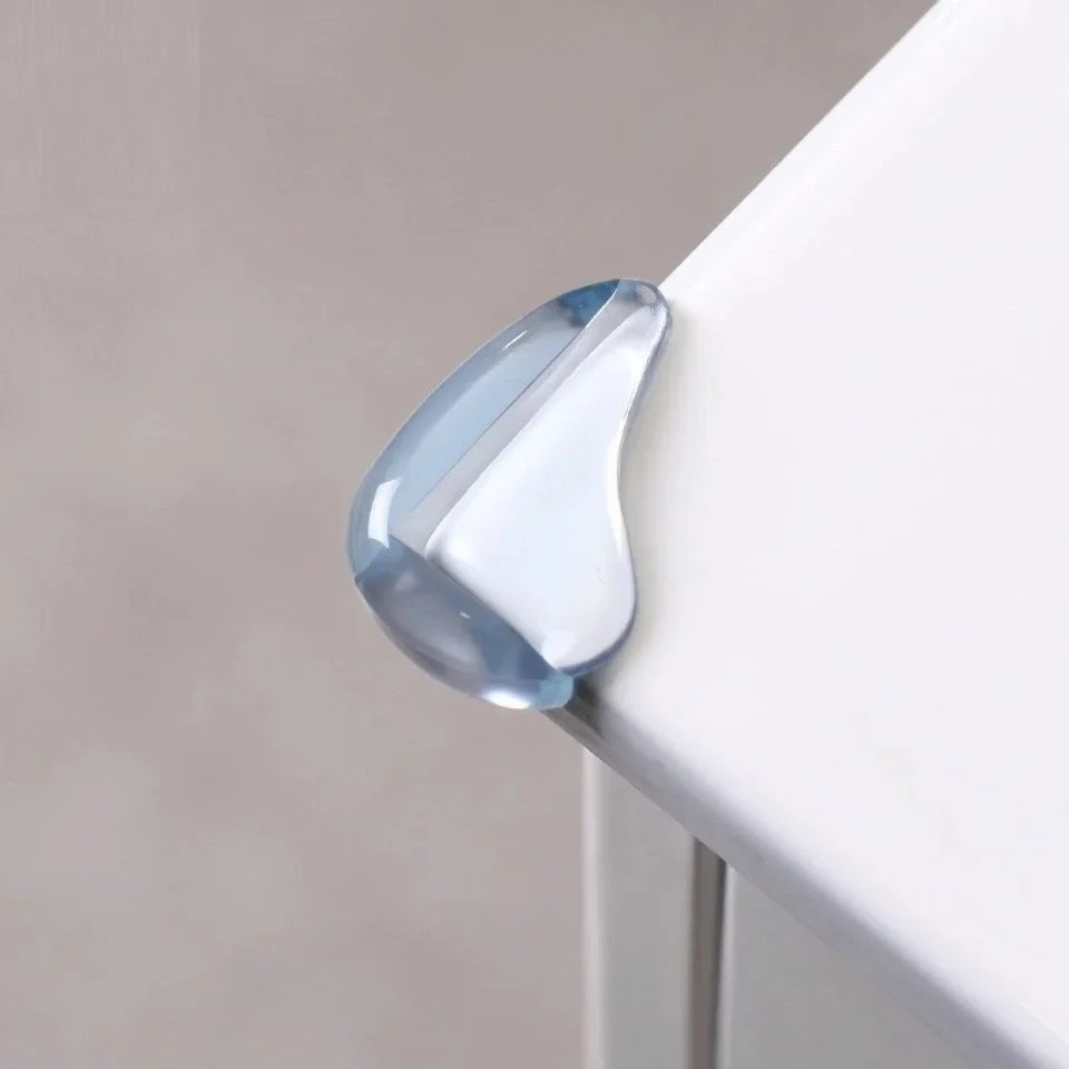 Clear PVC corner protector fitted over the corner of a white tabletop