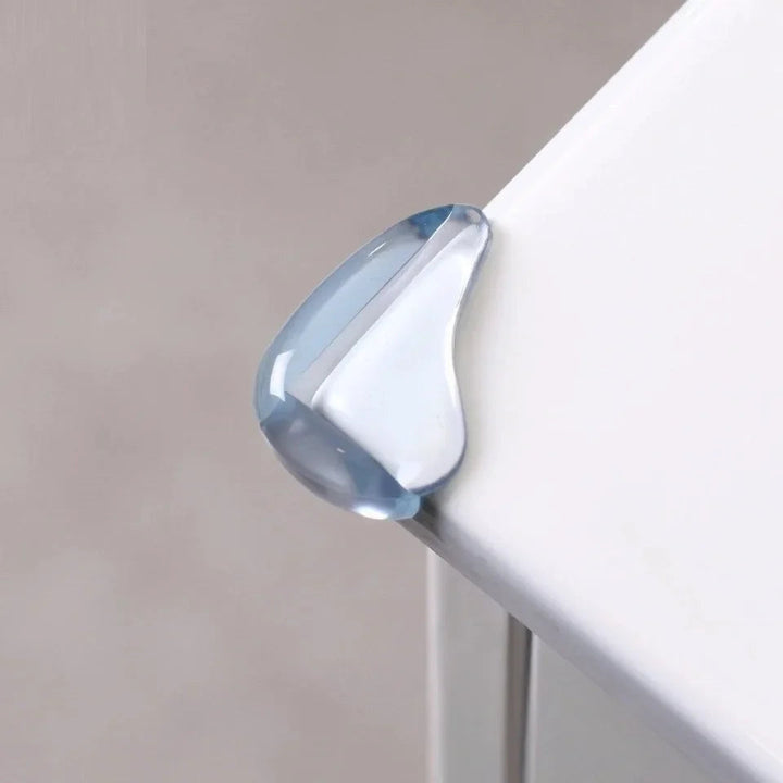 Clear PVC corner protector fitted over the corner of a white tabletop