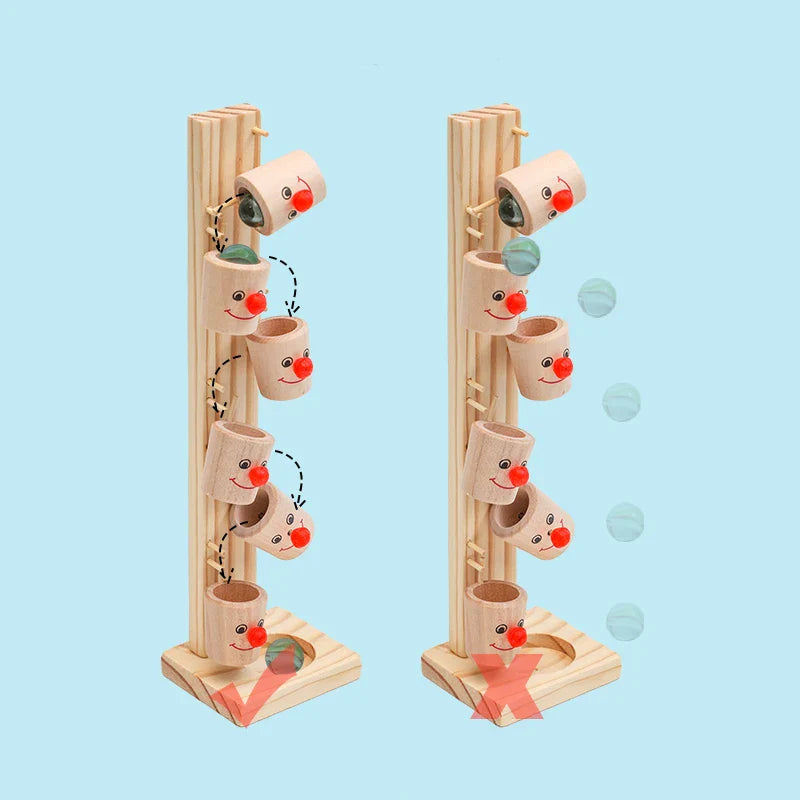 Two views of the wooden clown marble run illustrating how marbles move through the tipping cups