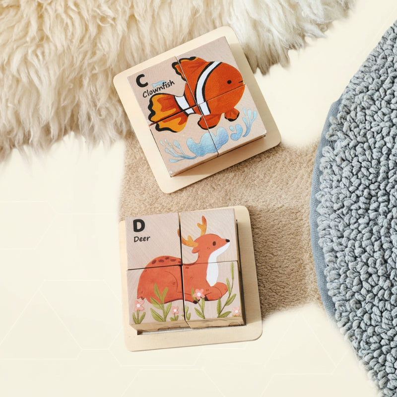 Clownfish and deer wooden block puzzles resting in their trays