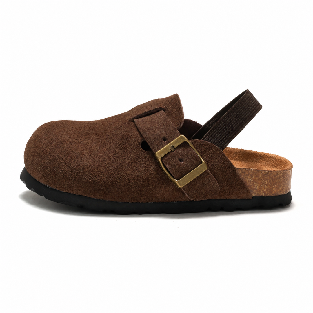 Coffee clog sandal in side view with a dark heel strap and buckle detail