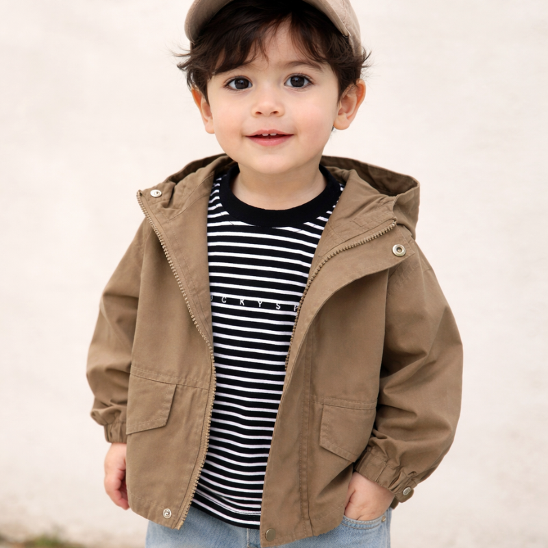 Child wearing an open coffee-colored hooded parka over a striped shirt