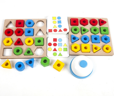 Two wooden shape puzzle boards with colorful blocks, pattern cards, and a blue-and-white bell