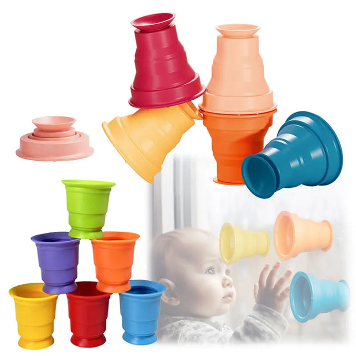 Multicolored silicone stacking cups arranged in a tower and attached to a wall
